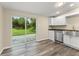 Modern kitchen with sliding doors and stainless steel appliances, providing a functional and stylish space for cooking and dining at 247 Toms Rd, Debary, FL 32713