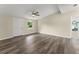 Inviting living space with modern flooring, vaulted ceilings, and plenty of natural light, perfect for comfortable living at 247 Toms Rd, Debary, FL 32713