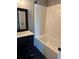 Renovated bathroom showcasing a stylish vanity and a clean, tiled bathtub at 2592 Grassy Point Dr # 306, Lake Mary, FL 32746