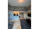 Living room and unfinished floors with stone accent walls creates a unique design element for customization at 2592 Grassy Point Dr # 306, Lake Mary, FL 32746