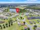 Discover this lovely neighborhood from above, featuring a community park and tranquil ponds at 3504 Cayugas Loop, St Cloud, FL 34772