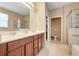 This bathroom features dual sinks, a glass-enclosed shower, and a separate area for a bidet at 3504 Cayugas Loop, St Cloud, FL 34772