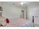 Comfortable bedroom with a ceiling fan, closet, and neutral wall color, perfect for relaxation at 3504 Cayugas Loop, St Cloud, FL 34772
