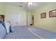 This room features blue accents and a neutral color scheme for relaxation at 3504 Cayugas Loop, St Cloud, FL 34772