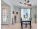 Charming dining area with a modern glass-top table, tile flooring, and elegant decor at 3504 Cayugas Loop, St Cloud, FL 34772