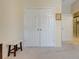 Hallway featuring double closets and a bench, offering ample storage and a convenient place to sit at 3504 Cayugas Loop, St Cloud, FL 34772