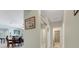 Hallway and dining area showcasing a seamless transition and decorative elements at 3504 Cayugas Loop, St Cloud, FL 34772