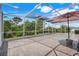 Large screened patio offers an ideal space for relaxing and entertaining, surrounded by lush greenery at 3504 Cayugas Loop, St Cloud, FL 34772