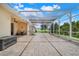 Spacious covered patio with outdoor seating, perfect for enjoying the backyard views and relaxing at 3504 Cayugas Loop, St Cloud, FL 34772