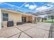 Spacious screened patio with brick pavers, lounge furniture, and ample room for outdoor entertaining at 3504 Cayugas Loop, St Cloud, FL 34772
