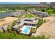 Aerial view of homes featuring a pool; surrounded by lush green landscaping and water features at 4007 Grande Brick Loop # 13, Orlando, FL 32837