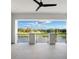 Balcony with an amazing view of the lake, a ceiling fan, and a black railing at 4007 Grande Brick Loop # 13, Orlando, FL 32837