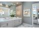 Elegant bathroom features a double sink vanity, modern lighting, and stylish decor at 4007 Grande Brick Loop # 13, Orlando, FL 32837