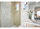 Modern bathroom featuring glass enclosed shower, mosaic tile, and decorative fixtures at 4007 Grande Brick Loop # 13, Orlando, FL 32837