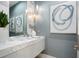 Modern bathroom vanity with marble countertop, sleek faucet, and contemporary light fixture at 4007 Grande Brick Loop # 13, Orlando, FL 32837