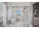 Bathroom with soaking tub and shower featuring glass surround and marble tile flooring at 4007 Grande Brick Loop # 13, Orlando, FL 32837
