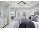 Bedroom with golf course views, large windows, tray ceilings and cool color palette at 4007 Grande Brick Loop # 13, Orlando, FL 32837