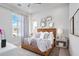 Comfortable bedroom featuring modern design, textured accents, and soft natural lighting at 4007 Grande Brick Loop # 13, Orlando, FL 32837