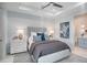 Comfortable bedroom featuring a tray ceiling, ceiling fan, and well-coordinated décor at 4007 Grande Brick Loop # 13, Orlando, FL 32837