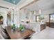 Dining room with view into the modern kitchen and backyard at 4007 Grande Brick Loop # 13, Orlando, FL 32837