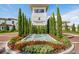 Elegant entrance to the Ritz-Carlton Residences with a water fountain and lush landscaping at 4007 Grande Brick Loop # 13, Orlando, FL 32837