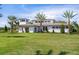 Stunning exterior elevation of home featuring a well-manicured lawn and a modern architectural design at 4007 Grande Brick Loop # 13, Orlando, FL 32837