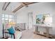 Hallway with exposed beam ceiling and a seating area with modern furnishings at 4007 Grande Brick Loop # 13, Orlando, FL 32837