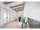 Hallway with exposed beam ceiling, sitting area, and railing at 4007 Grande Brick Loop # 13, Orlando, FL 32837