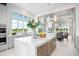 Gourmet kitchen with a marble island, upscale appliances, and views of the lush outdoor landscape at 4007 Grande Brick Loop # 13, Orlando, FL 32837