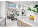 Bright, modern kitchen with white cabinets, a marble island, and pendant lighting at 4007 Grande Brick Loop # 13, Orlando, FL 32837