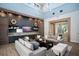 Elegant living room featuring custom built-ins, high ceilings, modern lighting, and comfortable seating at 4007 Grande Brick Loop # 13, Orlando, FL 32837
