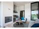 Outdoor kitchen on covered patio with built-in grill, fireplace, and seating with a view of the golf course at 4007 Grande Brick Loop # 13, Orlando, FL 32837