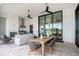Covered patio with outdoor kitchen, dining area, fireplace, and comfortable lounge space at 4007 Grande Brick Loop # 13, Orlando, FL 32837