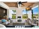 Relaxing outdoor living space with a fireplace, tv, and comfortable seating at 4007 Grande Brick Loop # 13, Orlando, FL 32837