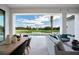 Outdoor living area featuring a golf course view, pool, and a dining and lounge area at 4007 Grande Brick Loop # 13, Orlando, FL 32837