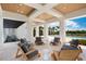 Tranquil outdoor seating area with unique chairs and access to the pool at 4007 Grande Brick Loop # 13, Orlando, FL 32837
