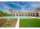 Inviting pool area with covered seating, manicured landscaping, and plenty of space for relaxation at 4007 Grande Brick Loop # 13, Orlando, FL 32837