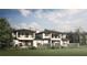 Beautiful backyard exterior with a covered patio, lush lawn, and serene landscaping at 4007 Grande Brick Loop # 13, Orlando, FL 32837