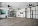 Spacious recreation room with hardwood flooring, stylish lighting, and built-in cabinetry at 4007 Grande Brick Loop # 13, Orlando, FL 32837