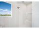 Bright shower with glass surround, tiled walls, and a view of the outside at 4007 Grande Brick Loop # 13, Orlando, FL 32837