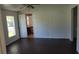 Bedroom with dark wood floors and a ceiling fan at 41 Sunset Cir, Lake Alfred, FL 33850