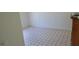 This bedroom features a patterned vinyl floor and white walls at 41 Sunset Cir, Lake Alfred, FL 33850
