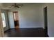 Bedroom with dark wood floors and a ceiling fan at 41 Sunset Cir, Lake Alfred, FL 33850