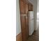 Classic kitchen with wooden cabinets and a white refrigerator, offering ample storage space at 41 Sunset Cir, Lake Alfred, FL 33850