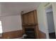 Living room showcasing a fireplace, wood paneling, and ample lighting at 41 Sunset Cir, Lake Alfred, FL 33850