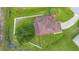 Aerial view of a well maintained home showcasing a beautiful green lawn, mature tree and white vinyl fenced in backyard at 412 Mallard Way, Kissimmee, FL 34759