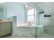Bright bathroom features a glass enclosed shower and a soaking tub at 412 Mallard Way, Kissimmee, FL 34759