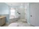 Bright bathroom features a glass enclosed shower and a soaking tub at 412 Mallard Way, Kissimmee, FL 34759