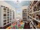 Bonus room featuring custom shelving, a table with chairs, and colorful rug at 412 Mallard Way, Kissimmee, FL 34759