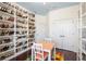 Bonus room featuring custom shelving and a table with chairs at 412 Mallard Way, Kissimmee, FL 34759